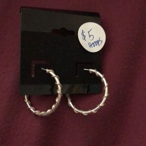 Hoop earrings with twisting designs